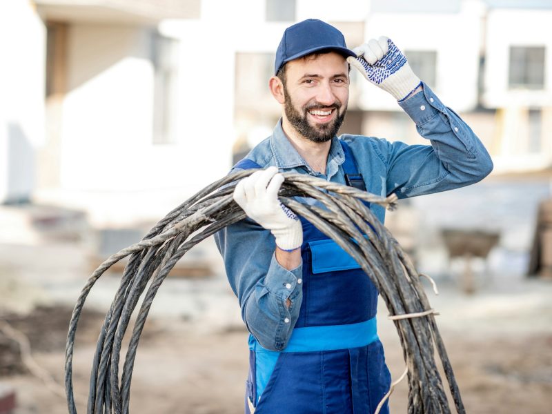 Electrician portrait with power cable